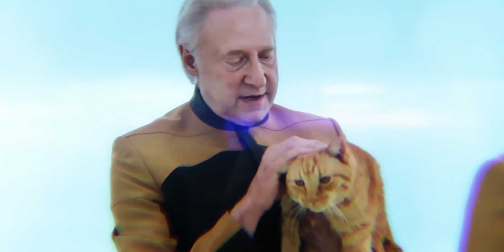 Data the android stroking his pet cat Spot